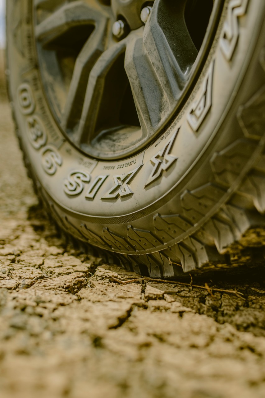 Close-up of a heavy-duty 4x4 tire tread from BND Car Hire, built to handle the challenging terrains of Namibia.