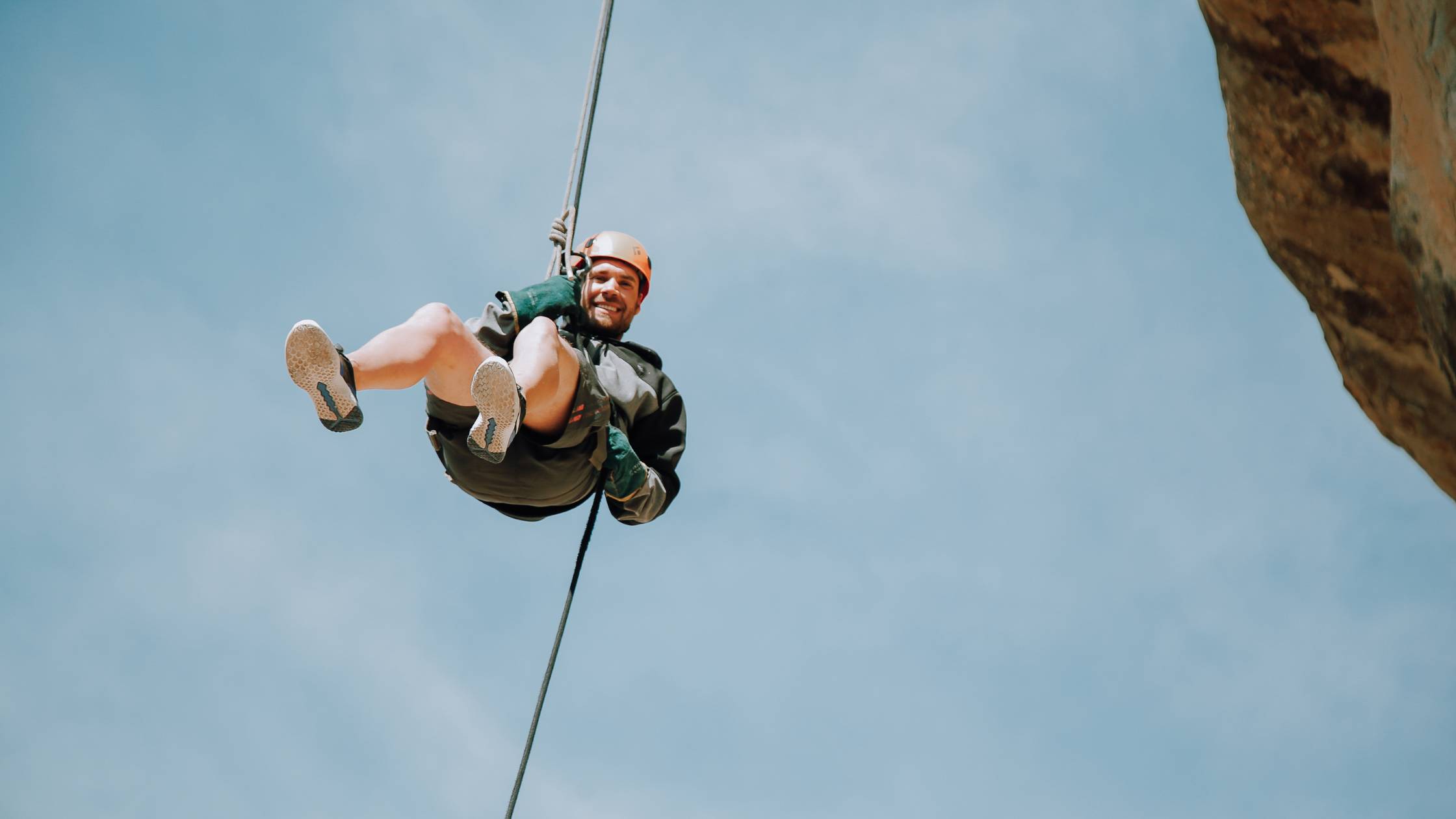 Adventure seeker ziplining in one of the top cities to visit in South Africa.