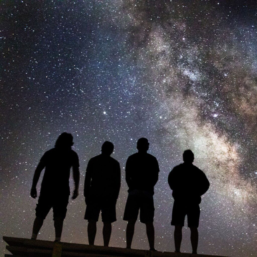 A starry night sky over a campsite in Botswana, perfect for adventurous 4x4 travelers.